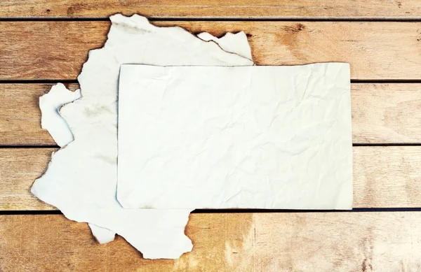 Old paper sheets on a wooden table — Stock Photo, Image