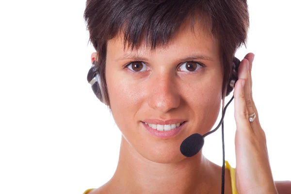 Glad receptionist med headset — Stockfoto