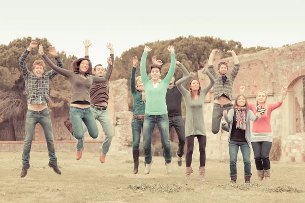 Multicultural College Students Jumping — Stock Photo, Image