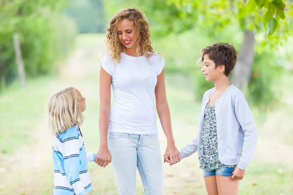 Beautiful Young Woman with Two Children Outside — Stock Photo, Image
