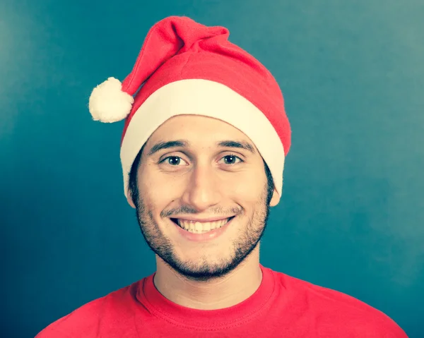 Joven con sombrero de Santa —  Fotos de Stock