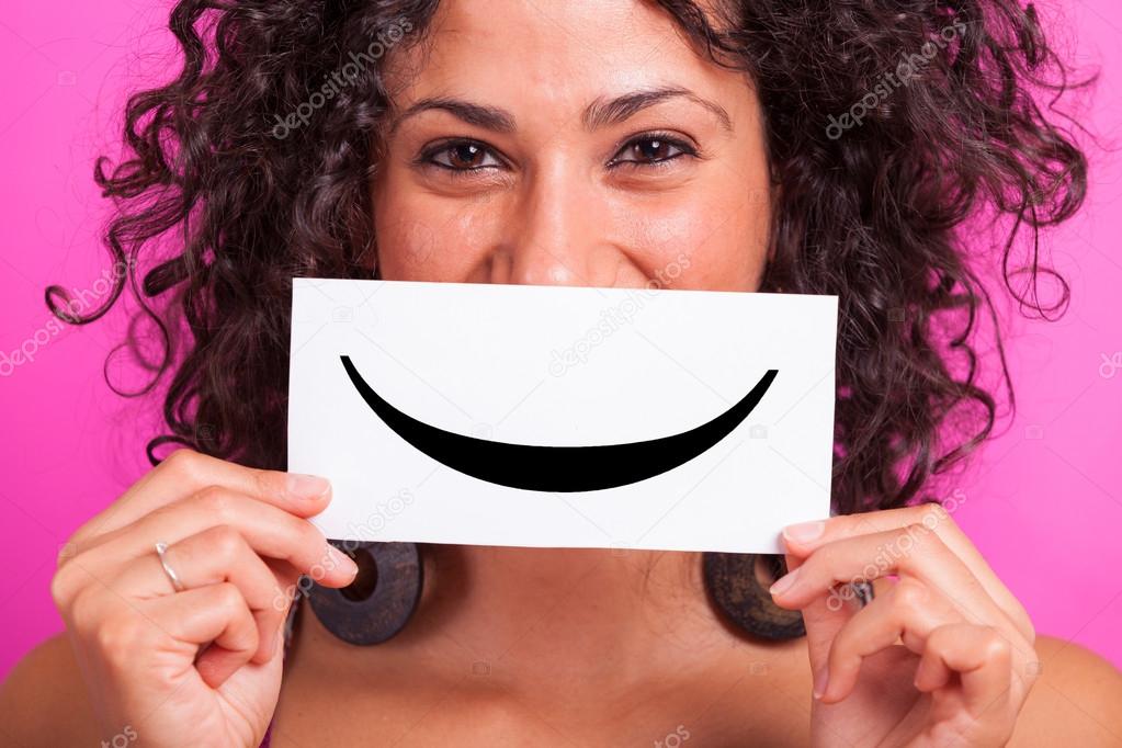 Young Woman with Smiley Emoticon on Fuchsia Background