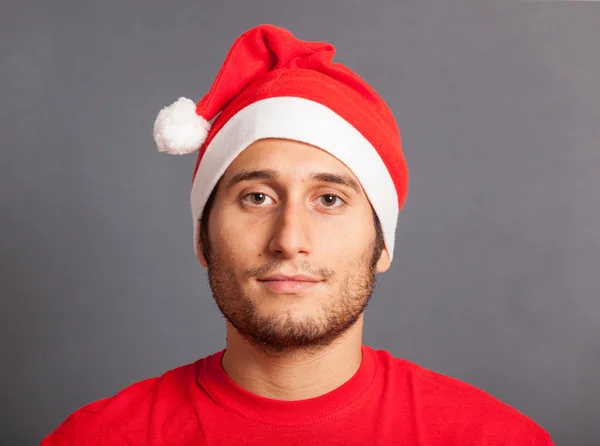 Homem jovem com chapéu de Santa — Fotografia de Stock