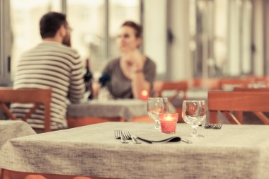 Romantic Young Couple at Restaurant clipart