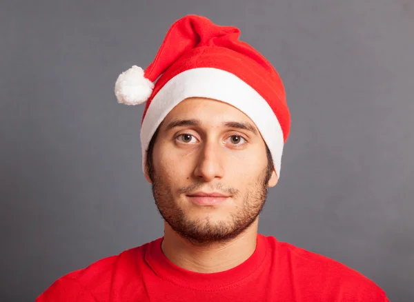 Mladý muž s santa hat — Stock fotografie
