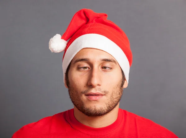 Mladý muž s santa hat — Stock fotografie