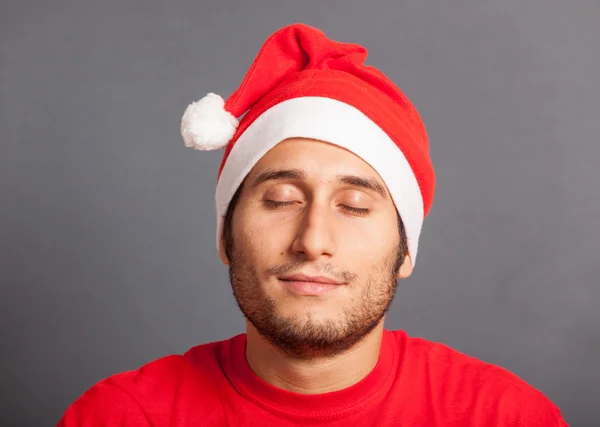 Homem jovem com chapéu de Santa — Fotografia de Stock