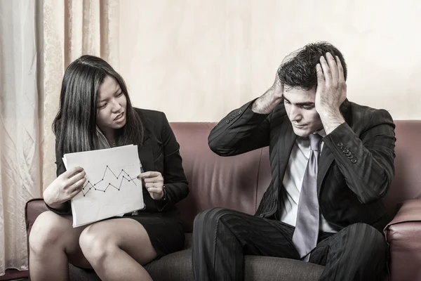 Sad Business Couple on the Sofa — Stock Photo, Image