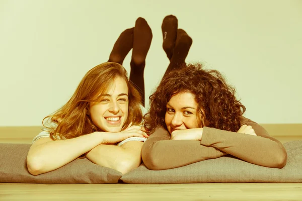 Two Beautiful Women Lying Down with Pillow — Stock Photo, Image