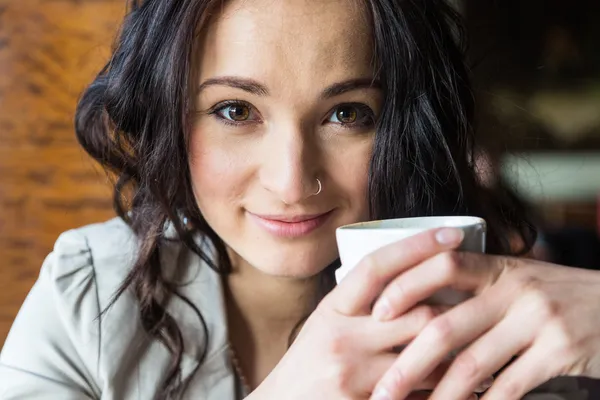 Young Woman Holding a Cup of Hot Beverage — Stock Photo, Image