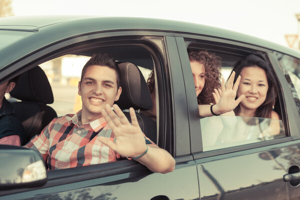 Boys and Girls in a Car Leaving for Vacation