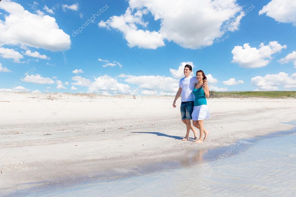 Young Couple Walking on Caribbean Beach