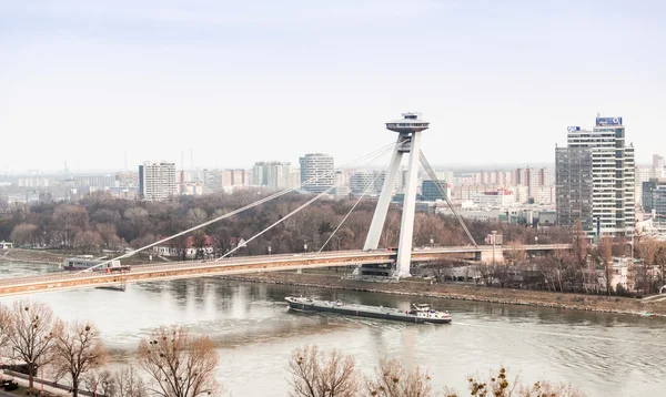 New futuristic bridge with skyscrapers on background — Stock Photo, Image