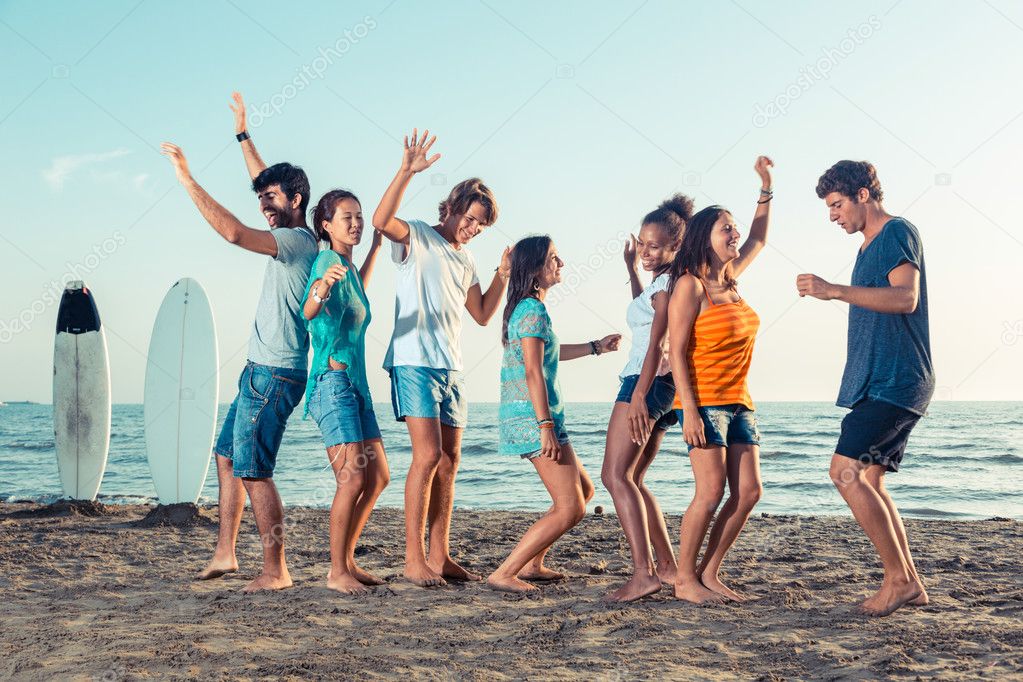 Group of Friends Having a Party on the Beach