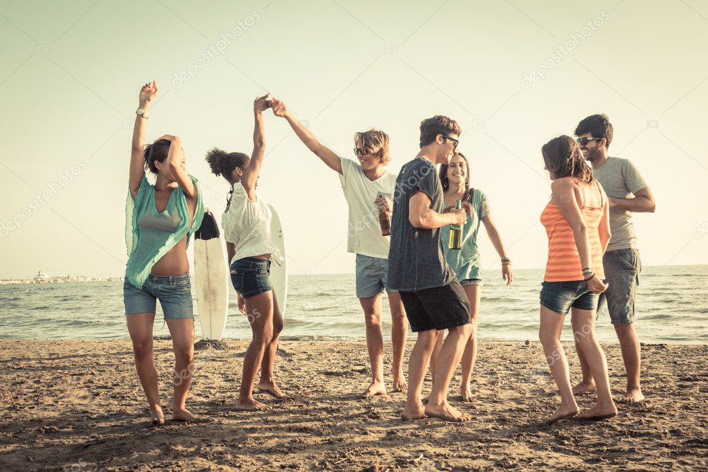 Group of Friends Having a Party on the Beach