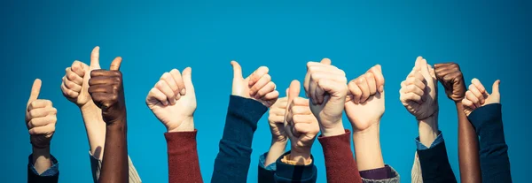 Multiracial Thumbs Up Against Blue Sky — Stock Photo, Image