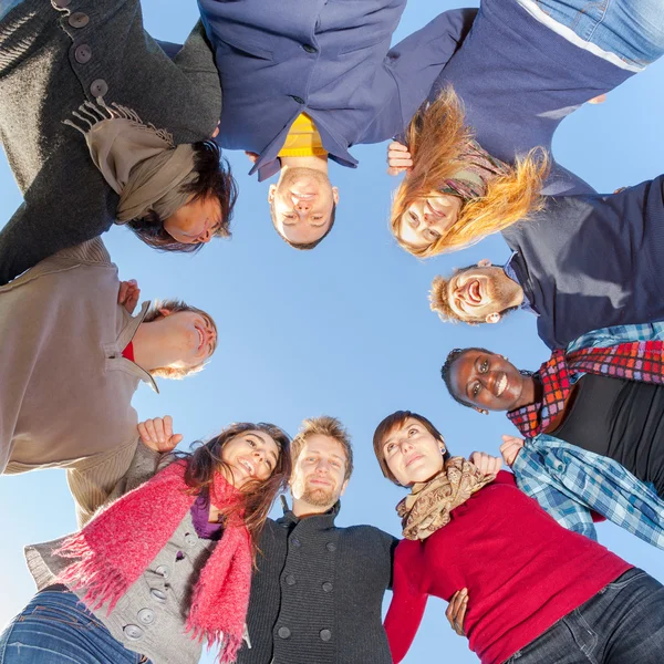 Multiracial People Holding Hands in a Circle, Low Angle View — Stock Photo, Image