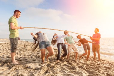 Friends Dancing Limbo at Beach clipart