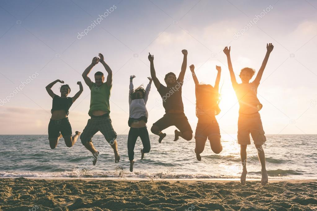 People Jumping at Beach