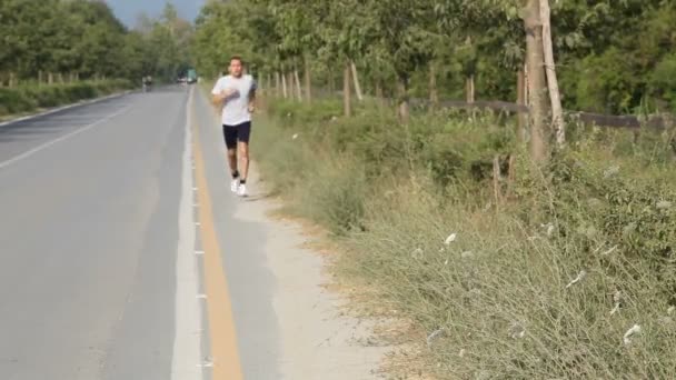 Young Man Jogging — Stock video