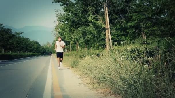 Young Man Jogging — Stock Video