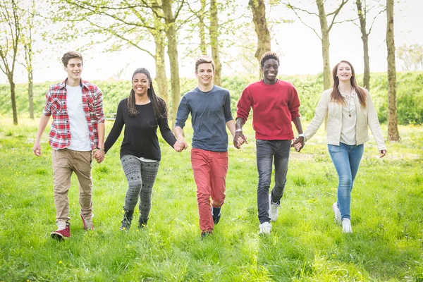 Teenagers running in Park — Stock Photo, Image