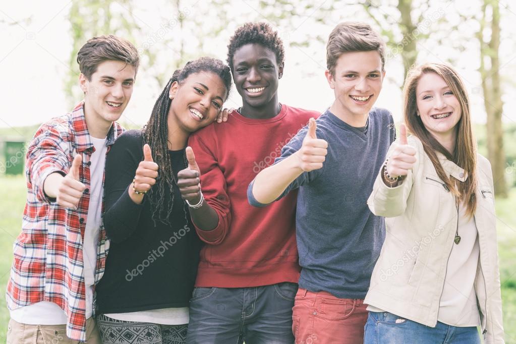 Teenagers showing Thumbs Up