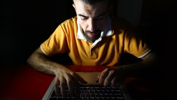 Young Man Typing in a Dark Room — Stock Video