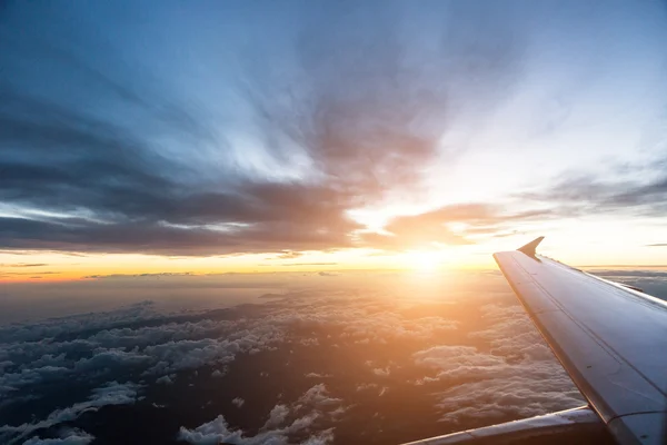 Cloudy sky through airplane window — Stock Photo, Image