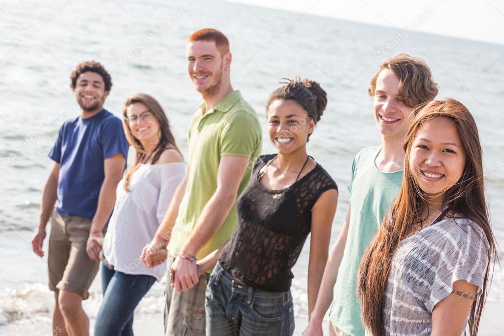 Multiracial Group of Friends Walking at Beach