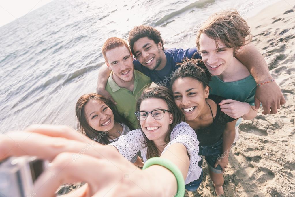 Multiracial Group of Friends Taking Selfie at Beach