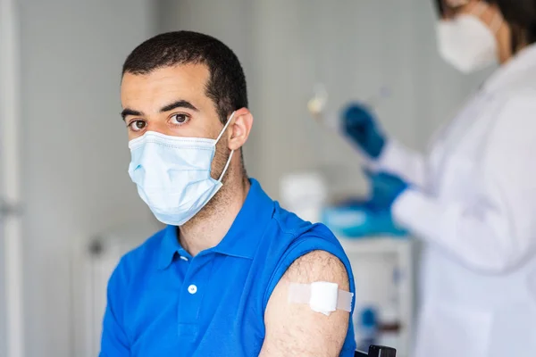 Man Receiving Covid Vaccine Jab Vaccination Centre Female Doctor Administering — Stock Photo, Image