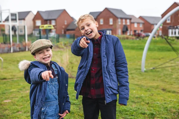 Young Boys Laughing Pointing Camera Two Boys Having Fun Mocking — Stock Photo, Image
