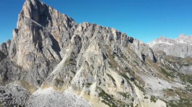 Aerial and panoramic view of Dolomites mountains in the Alps in Italy on a sunny day - Nature and travel concepts with beautiful scenery