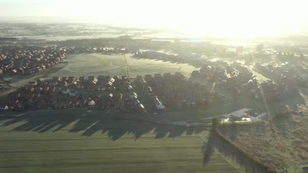 Aerial View Houses Residential Estate Early Morning Shadows Green Fields — Stockvideo