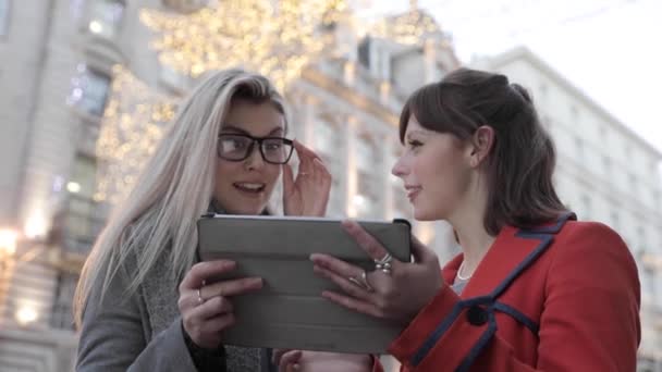 Authentic Shot Two Happy Female Friends Looking Digital Tablet London — стоковое видео