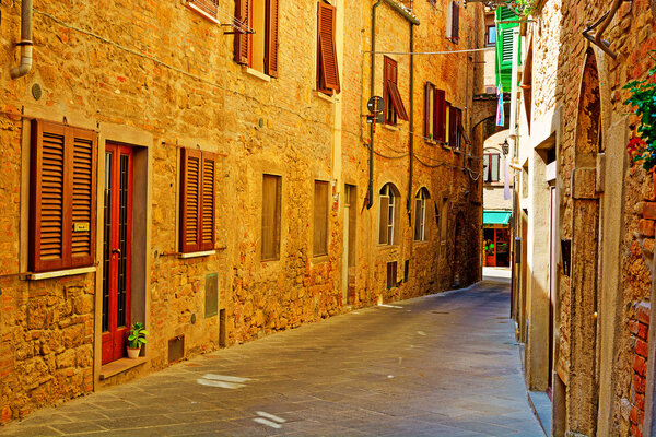 Narrow Alley with Old Buildings in Italian City of Volterra