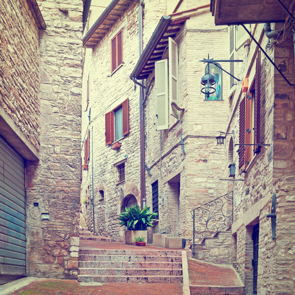 Narrow Alley with Old Buildings in Italian City of Assisi, Instagram Effect