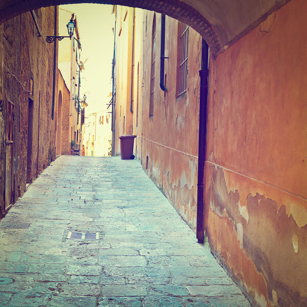 Narrow Alley with Old Buildings in Italian City of Volterra, Instagram Effect