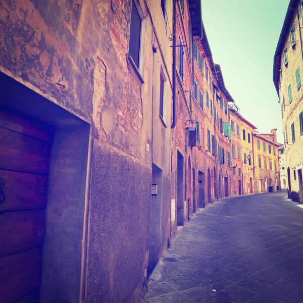 Narrow Alley with Old Buildings in Italian City of Siena, Instagram Effect