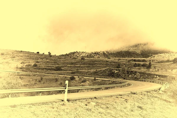 Winding Asphalt Road Spain Stylized Photo — стокове фото