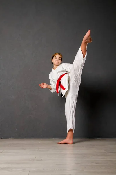 Young Girl Karateka White Kimono Red Belt Trains Performs Set — Stock Photo, Image