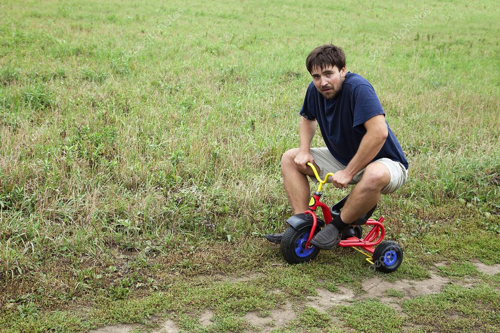 depositphotos_13544356-stock-photo-adult-man-on-a-small.jpg