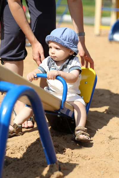 Child on seesaw — Stock Photo, Image