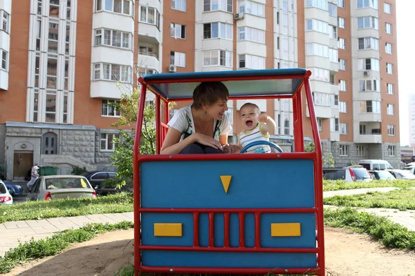 Family playing in toy car — Stock Photo, Image