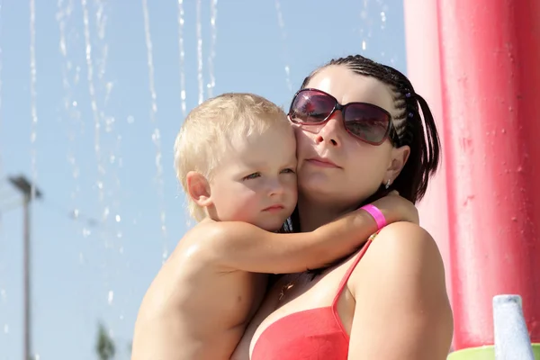 Child embracing mother — Stock Photo, Image