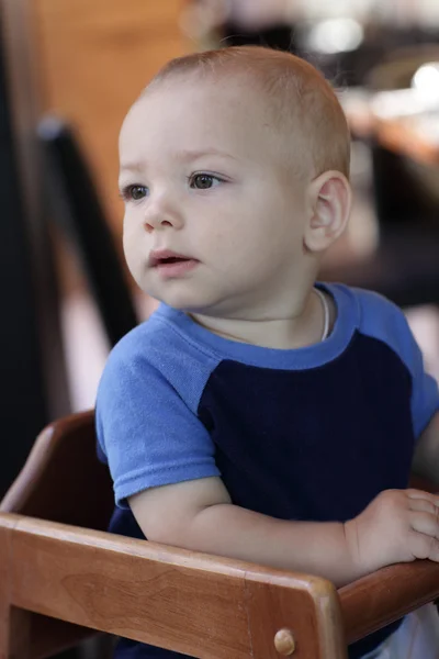 Baby in highchair — Stock Photo, Image