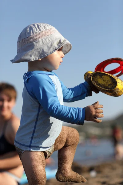 Toddler walking with toy — Stock Photo, Image