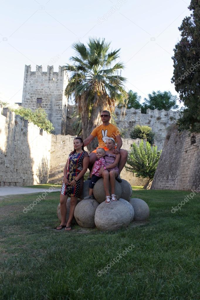 Family on castle of Rhodes background
