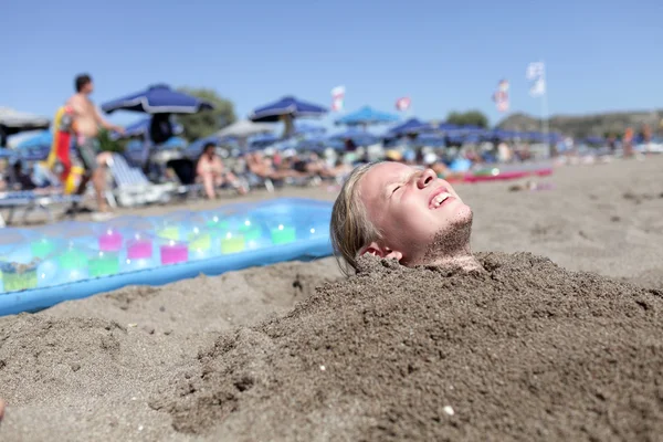 Girl in sand — Zdjęcie stockowe